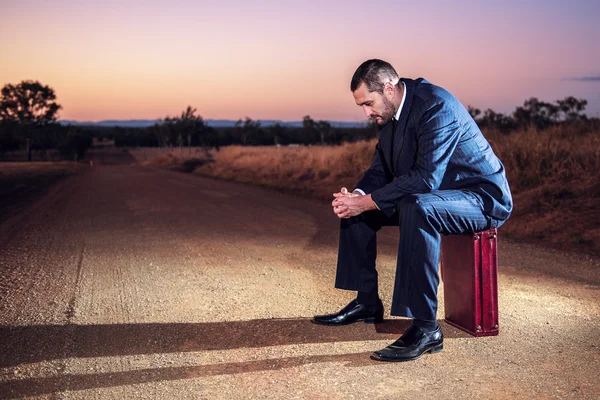 Frustrated businessman in the outback 